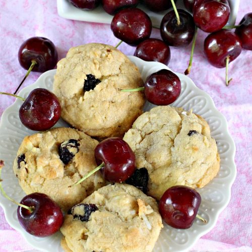 White Chocolate Cherry Coconut Cookies | Can't Stay Out of the Kitchen | these amazing #cookies have it all! They're festive, beautiful and taste incredibly good. Perfect for #holiday parties or #ChristmasCookieExchanges. #tailgating #dessert #ChocolateDessert #WhiteChocolateChips #Cherries #coconut #CherryDessert