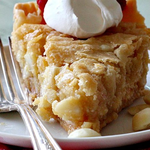 White Chocolate Macadamia Nut Pie | Can't Stay Out of the Kitchen | this rich, decadent, heavenly #pie will have you drooling from the first bite! It's a fantastic #dessert for the #holidays. It's filled with #MacadamiaNuts & #WhiteChocolateChips. Spectacular doesn't even begin to adequately describe this amazing #ChocolatePie. #WhiteChocolateMacadamiaNutPie #HolidayDessert
