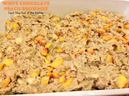White Chocolate Peach Brownies | Can't Stay Out of the Kitchen | these fantastic #brownies are ooey, gooey decadent & divine! They're filled with #coconut, #walnuts, #peaches & white #chocolatechips. Then they're drizzled with white #chocolate icing. This #dessert is fantastic during the #summer when peaches are in season.
